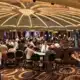 Beat the System! A busy land casino floor with people playing at all the tables