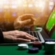 woman playing South African Online Gambling on a laptop
