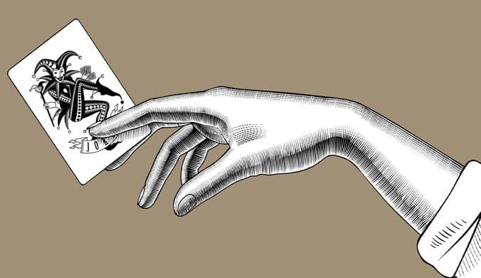 An illustration of a black and white drawing of a female hand holding a joker card on light brown background